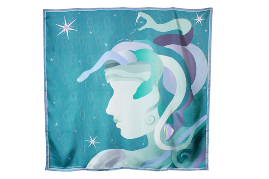 A large square silk scarf, Halcyon Medusa by The Line Atelier, featuring a stylized profile of a Medusa's face with flowing snake hair in shades of teal, purple, and white, set against a starry turquoise background.