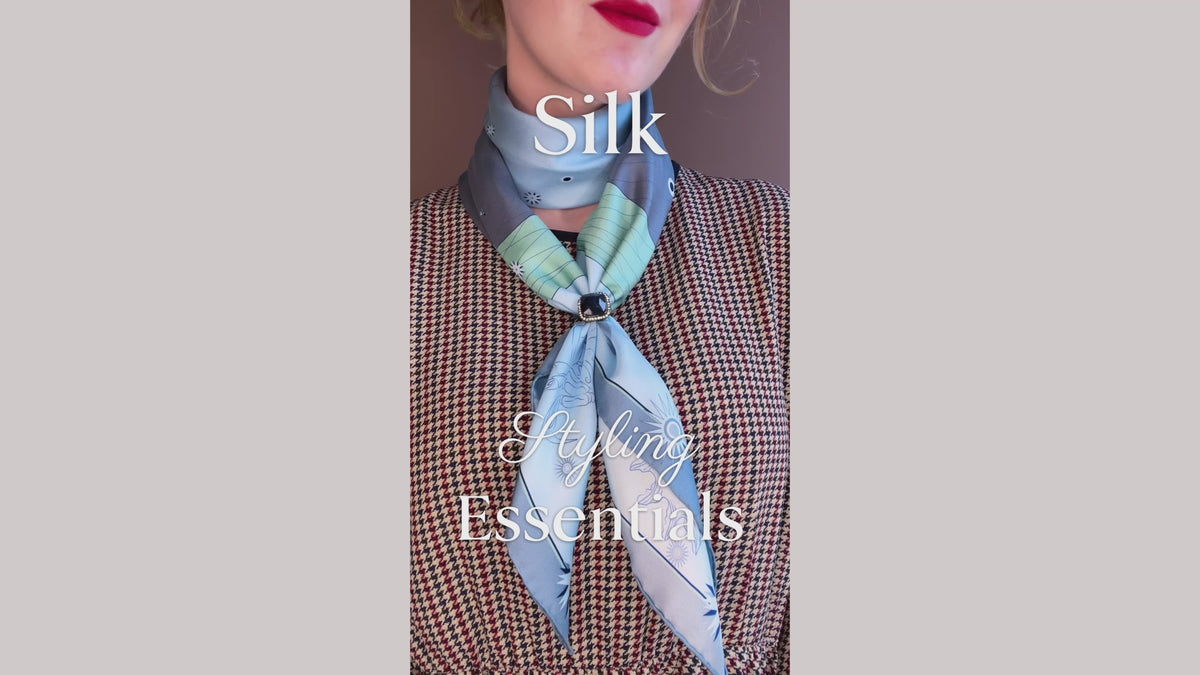 Load video: Silk scarf styling tutorial for an adjustable  and chic style using a large silk scarf and a ring, by The Line Atelier